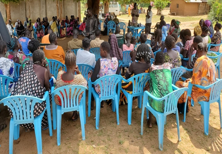 Community members discussing how they can be involved in Supporting the Commission of Truth, Reconciliation and Healing activities as a mechanism of Transitional Justice.